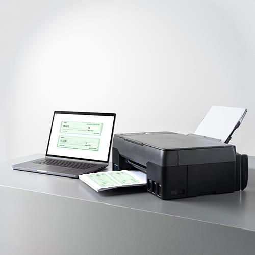 An Epson Printer and a Laptop on a Table, Featuring Free Print Check Software