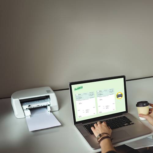 A Woman Uses a Laptop on a Desk with a Printer While Ensuring Design Checks.