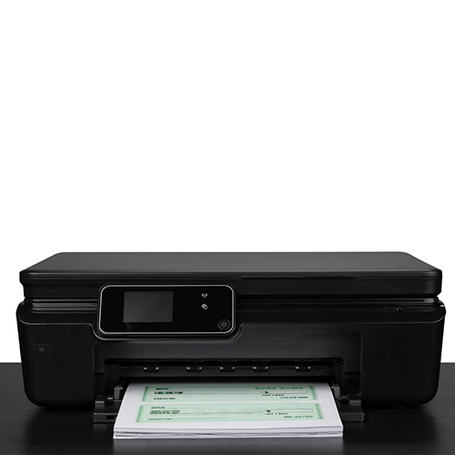 A Printer on Top of the Desk That Prints Checks Using Instant Checks Software