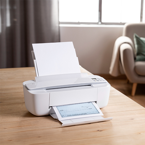 An Printer Sits on a Wooden Table. The Printable Bank Deposit Slip Is Printed on a Printer