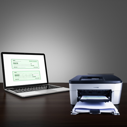Office Setup Featuring a Laptop and Printer for a Check Printing Service, Prepared to Print Documents