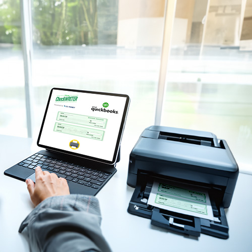 A Person Working on a Laptop Printing QuickBooks Checks, Saying Goodbye to the Hassle of Check Printing with Easy QuickBooks Online Integrations.