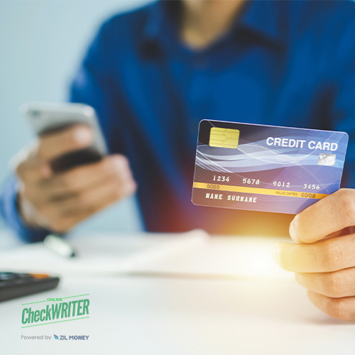 A Person Holding a Credit Card He Is Making Amex Credit Card Payments Easily