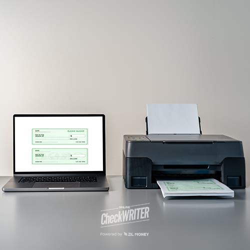 A Laptop Displaying a Best Free Check Writing Software Interface Next to a Printer That Is Printing Checks