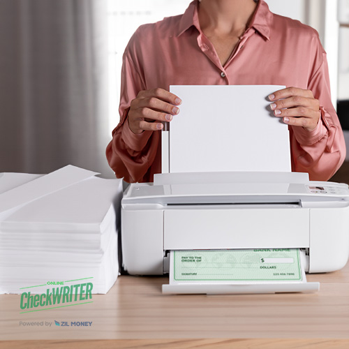 A Person Inserts a Blank Sheet into a White Printer on a Desk, Symbolizing Print Checks Securely on Blank Paper Online