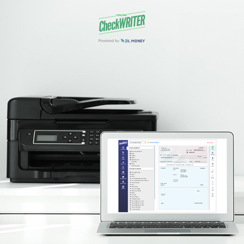 A Computer and Printer Are on the Table. Checks Are Created Using the Check Designer Tool