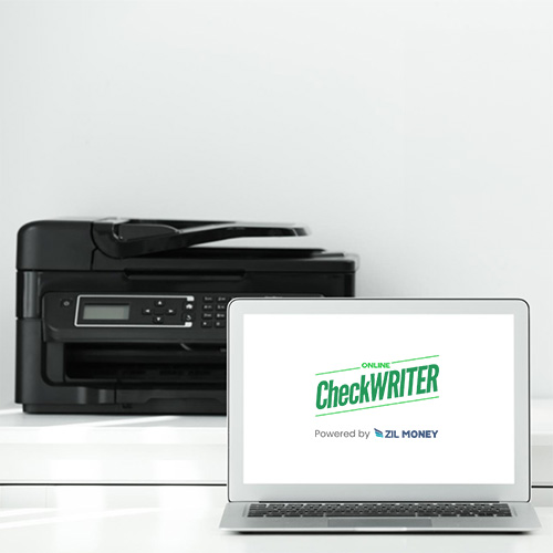 A Laptop Sits on the Front of the Printer. Currently Its Creating Checks Using Free Online Check Printing Software