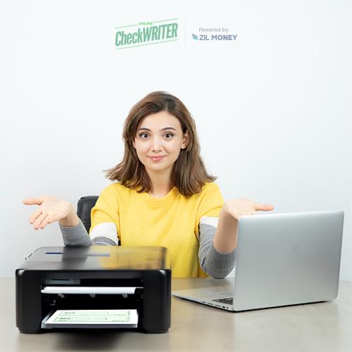 A Young Woman with a Laptop and a Printer That Is Printing a Check Instead of Order Walmart Checks