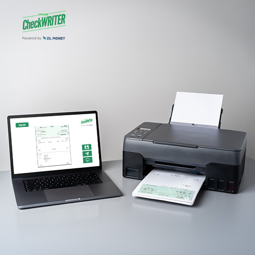 A Laptop Displaying Check Printing Software, an Alternative to Costco Checks Order, Next to a Black Printer on a Desk.