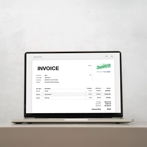 A Computer Is on the Table. It Displays How To Send An Invoice
