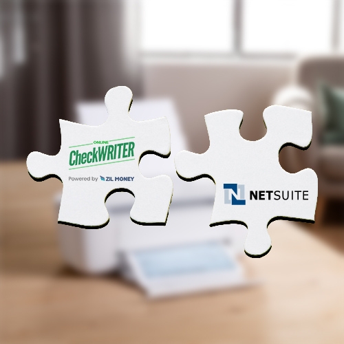 Two Hands Hold Puzzle Pieces Against a White Background. This Indicates NetSuite Integration with Check Printing Software
