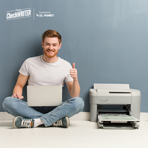 A Man Sitting Next To A Printer Printing Checks. Free Bank Checks Online The Smart Choice for Modern Banking