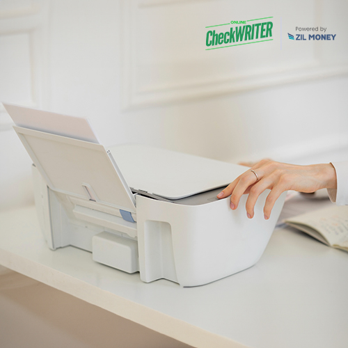 The Printer Is on the Table. a Man Prints Free Online Check Writing And Printing