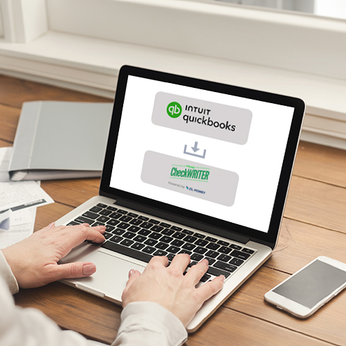 A Man Working on a Laptop Displays QuickBooks Check Printing Software, He Import Checks for Secure Transaction