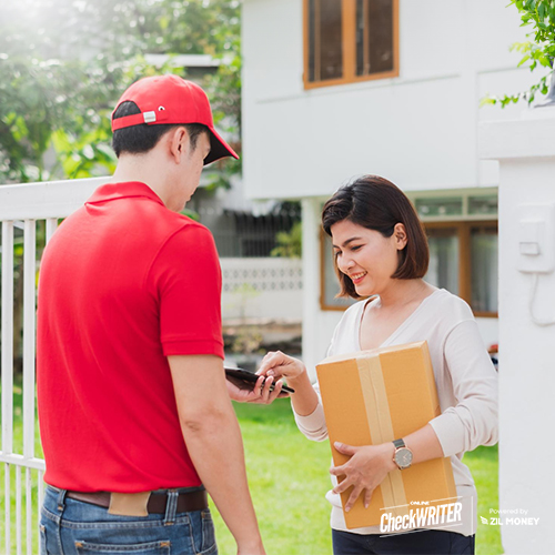 A Man Delivering Checks To A Women, Simplifying Payments The Advantages of Overnight Check Mailing