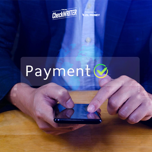 A Person in a Suite Holding a Smartphone Sending Payments. Transform Your Business Payments with the Ultimate PayPal Alternative