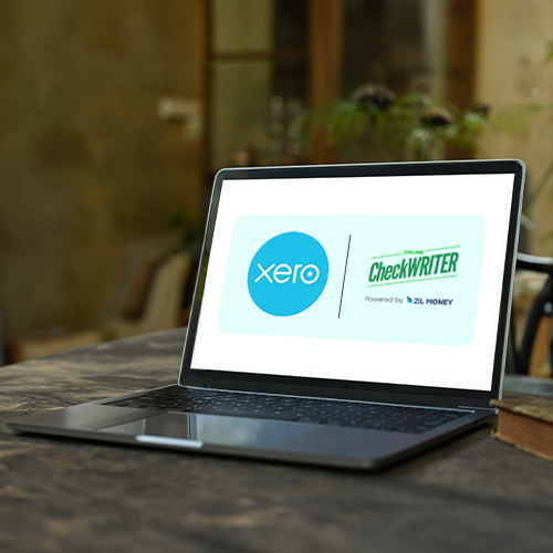 A Laptop Displays a Digital Interface of a Xero Integration with The Check Printing Platform