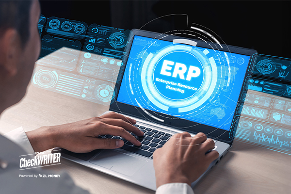 A Person Working On a Laptop Makes ERP and API Integration, Makes Your Business Transactions Easier