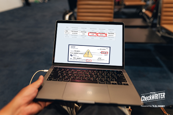 A Person Working On a Laptop Designing Checks, Checks Design, Printing, & Mailing Make Vendor Payments Easy, Symbolizing Positive Pay Definition