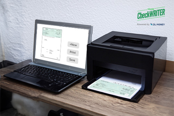 A Laptop And A Printer Printing Checks, Making Payments Easier Small Business Check Printing for Modern Consulting Companies