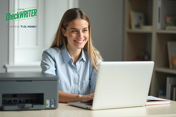 A Woman Printing Checks Using Check Generator Software with A Regular Printer. Instant Checks Printing Solutions Instead of Pre-Printed Checks