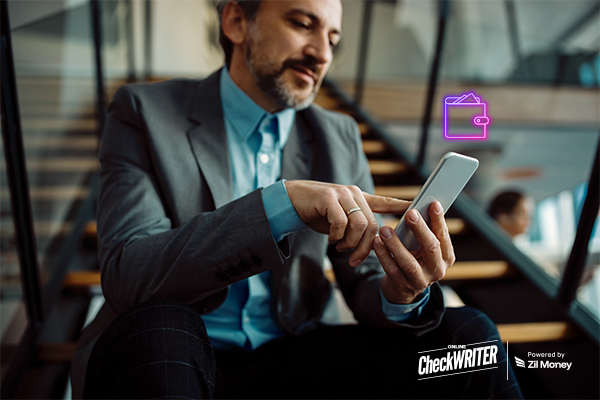 Digital Wallet User Managing Business Finances on a Smartphone; a Businessman in a Suit Uses a Mobile Device, Symbolizing Digital Payment Convenience.