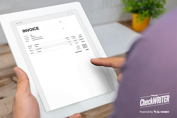 How to Send an Invoice Through an Efficient Platform, as Shown by a User Reviewing an Invoice on a Tablet.