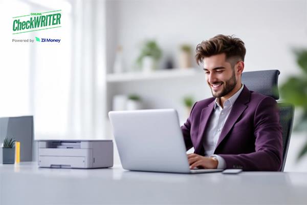 A Man Using A Laptop to Make a Payment. Represents Print Inexpensive Checks Online Using Blank Stock Paper