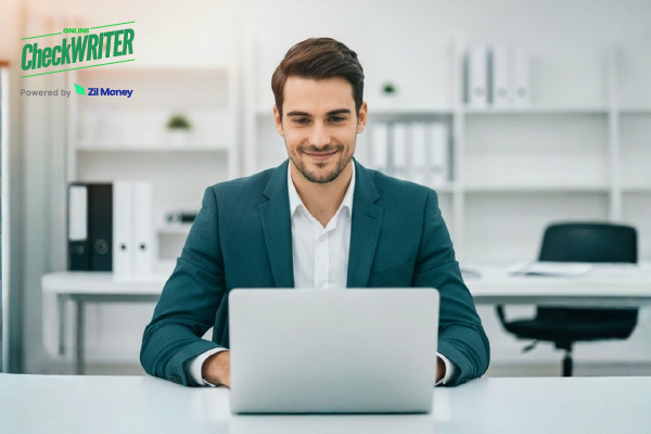 Integration with NetSuite Shown as a Man in a Suit Working on a Laptop in an Office, Representing Easy Business Growth and Payment Tracking.