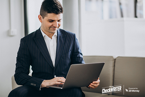 A Man Using A Laptop for Receive Check for Bonus Payouts | Fast, Simple, and Personalized