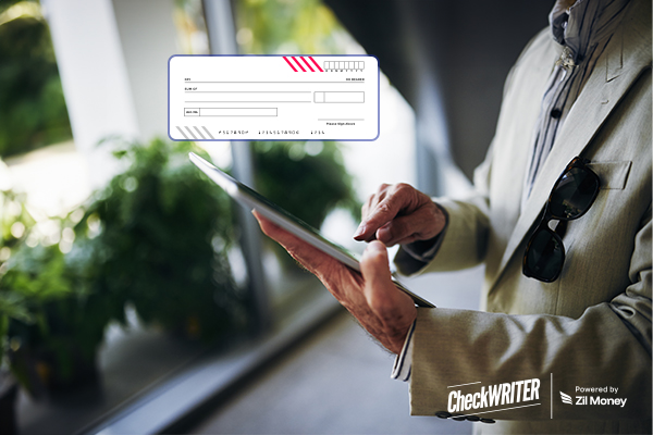 A Man Using a Tablet to Make a Check Payment. Represents Positive Pay