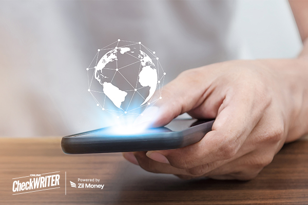 A Person Using a Smartphone with a Glowing World Map Overlay, Highlighting the Speed and Ease of International Payments Across Borders.