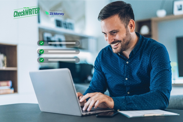 A Man Using a Laptop to Make Bulk Payment Easily. Send Payment Via ACH and Wire