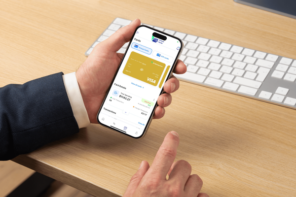 A Man Using A Phone To Make a Payment Easily. Bulk Virtual Card Creation | Instant & Secure Payment Solutions