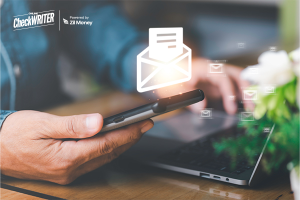 A person uses a smartphone to mail documents online, with a glowing email icon hovering above the screen.