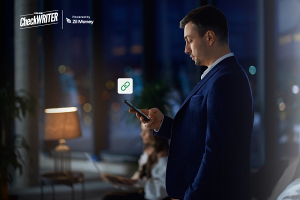 A businessman uses his phone at night, showing how payment links make receiving money quick and secure.