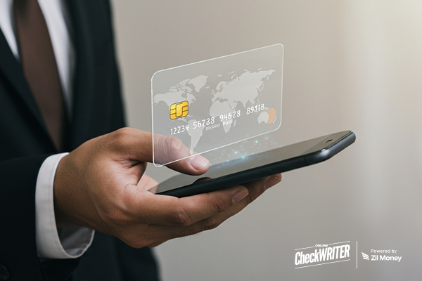 A businessman holds a phone displaying a digital Visa virtual card, representing secure and modern business payments.