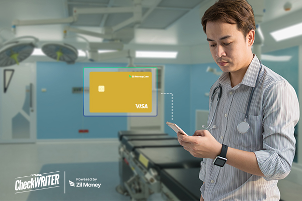 Doctor in Scrubs Looking at His Phone with a Digital Healthcare Expense Card Graphic Overlay in a Surgical Room.