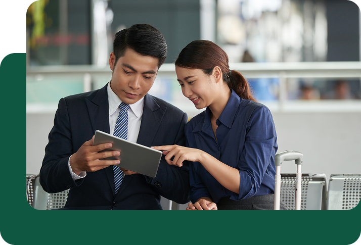 2 Persons Using a Tablet to Make International Payments Easily,  Send Money to Philippines from USA – Fast, Secure & Low-Cost