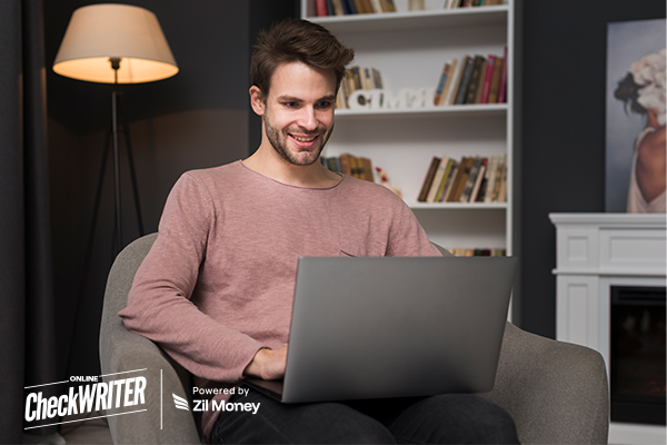 A Man Using A Laptop to Make a Payment Easily. eChecks for Faster, Low-Cost Digital Business Payments