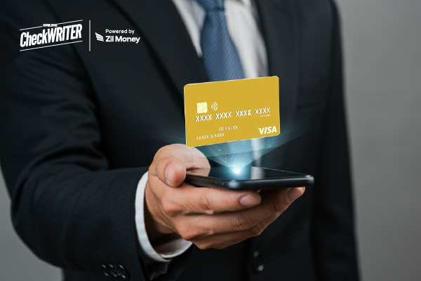 7 Ways Instant Virtual Cards and AI Are Redefining Expense Tracking in 2025 A Business Professional Holding a Phone with an Instant Virtual Card Displayed Digitally.