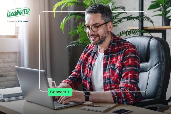 The NetSuite Integration Power-Up: How the Right Platform Guarantees Seamless Bill & Payment Command Today Business Owner Working on a Laptop to Connect Netsuite Integration for Streamlined Bill and Payment Management in a Modern Home Office.