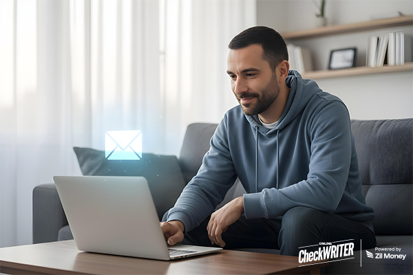 Stop the Stampede How Automated Check Mailing Rescues Small Business Workflows A man who watches a check getting mailed from his laptop.