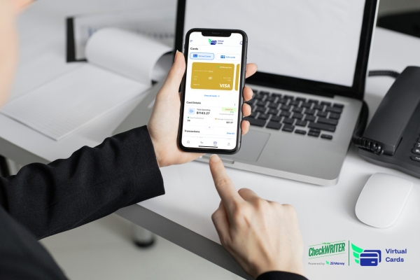 How Daily Limit Employee Cards Protect Business Cash Flow Without Slowing Work A person uses a mobile app showing virtual card details, highlighting secure spending with Daily limit employee cards for business use.