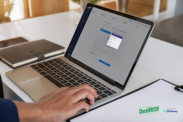 The Campus Operational Shield How Reliable Education Industry Payments Drive Seamless Success for Institutional Partners Today User typing on a laptop to process Education Industry Payments, offering a secure way to manage campus finances.