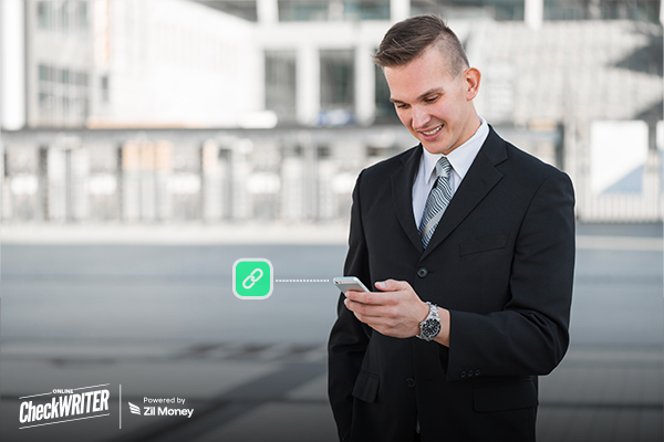 Why Businesses Still Struggle to Get Paid on Time and What Payment Links Change A businessman smiling at his phone, illustrating the convenience of sending Payment Links for quick transactions.