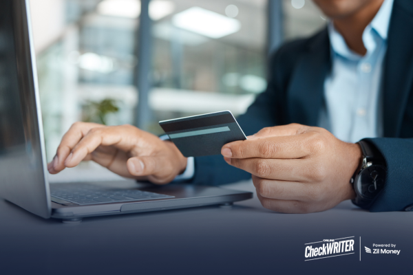 Pay Vendors with Credit Card and Take Full Control of Every Business Payment A business professional using a laptop and card to pay vendors with credit card for faster and secure business payments.