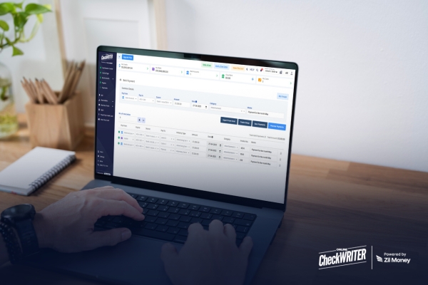 Why Finance Teams Still Lose Hours Every Month – And How Bulk Payments Fix It A person using a laptop with payment software to manage bulk payment processing efficiently.