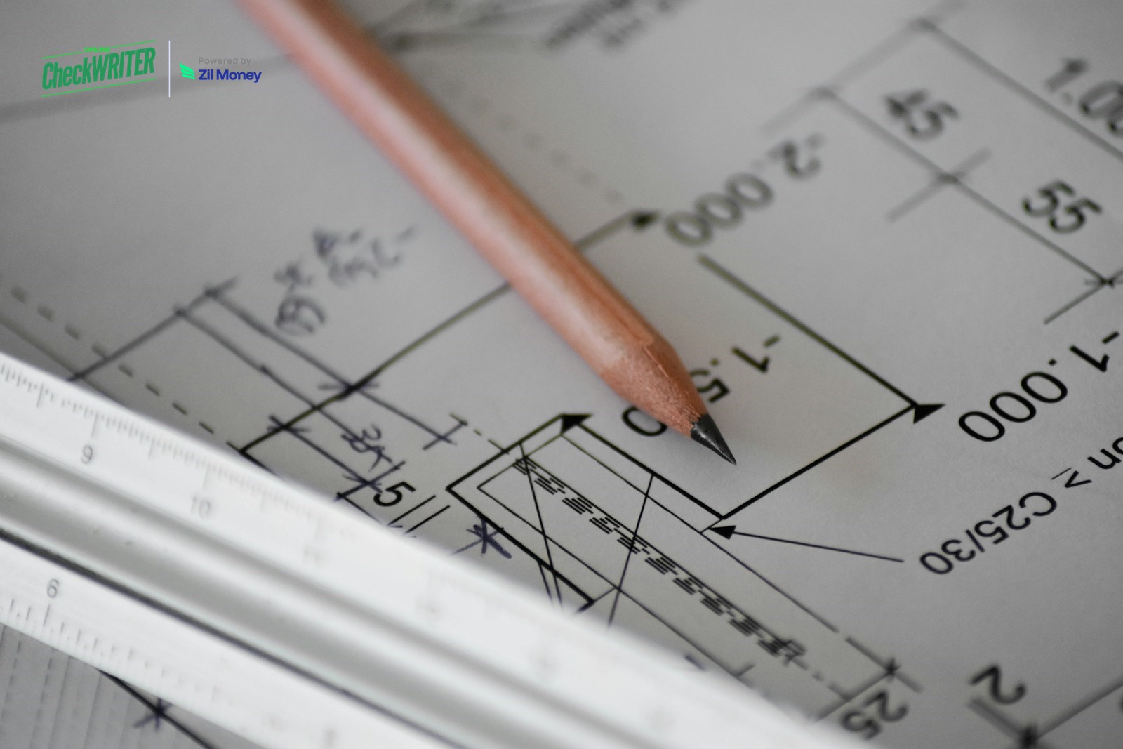 Construction blueprint check writer software Construction blueprint with pencil and ruler on a desk