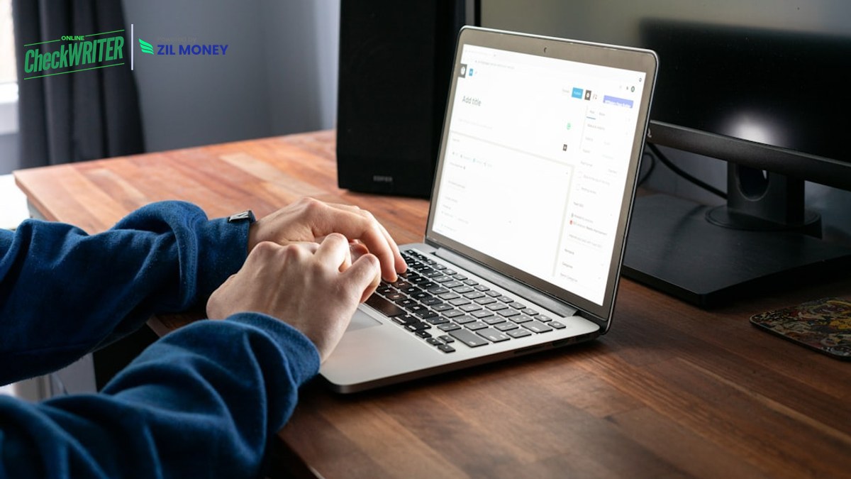 5 Smart Reasons to Send a Check by Email Instead of Mailing Paper AP manager using a laptop to send a check by email from the OnlineCheckWriter.com dashboard